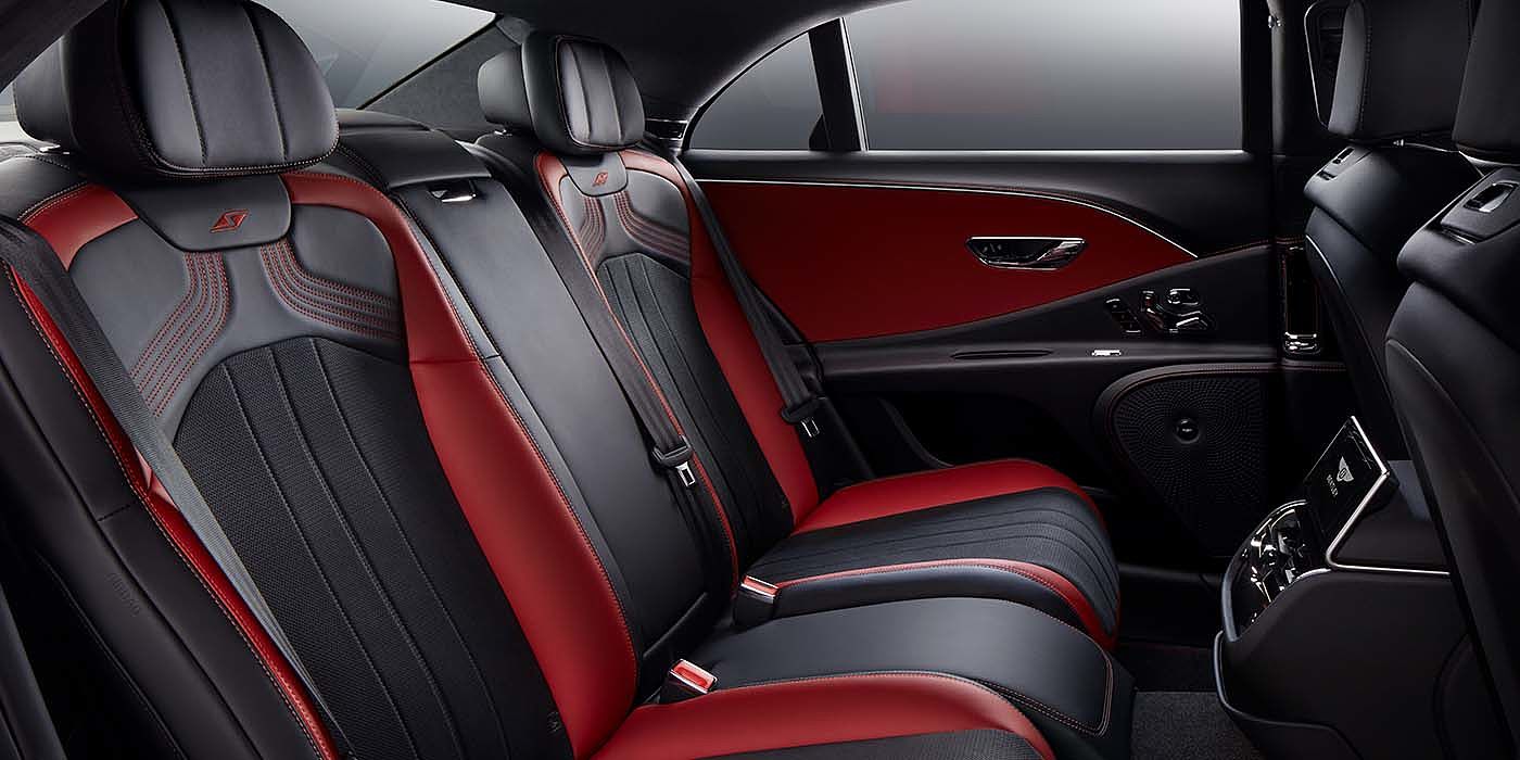 Bentley Paris Seine Bentley Flying Spur S sedan rear interior in Beluga black and Hotspur red hide with S stitching