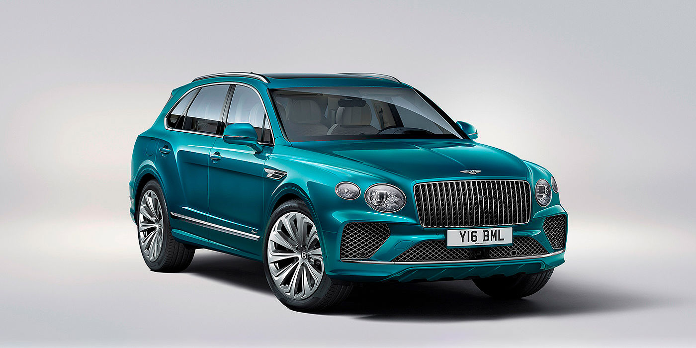 Bentley Paris Seine Bentley Bentayga Azure front three-quarter view, featuring a fluted chrome grille with a matrix lower grille and chrome accents in Topaz blue paint.