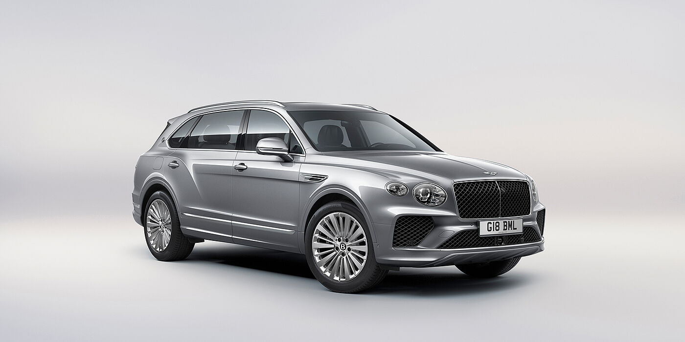 Bentley Paris Seine Bentley Bentayga Extended Wheelbase luxury SUV front three quarter view in Moonbeam paint with 21 inch five spoke painted wheels