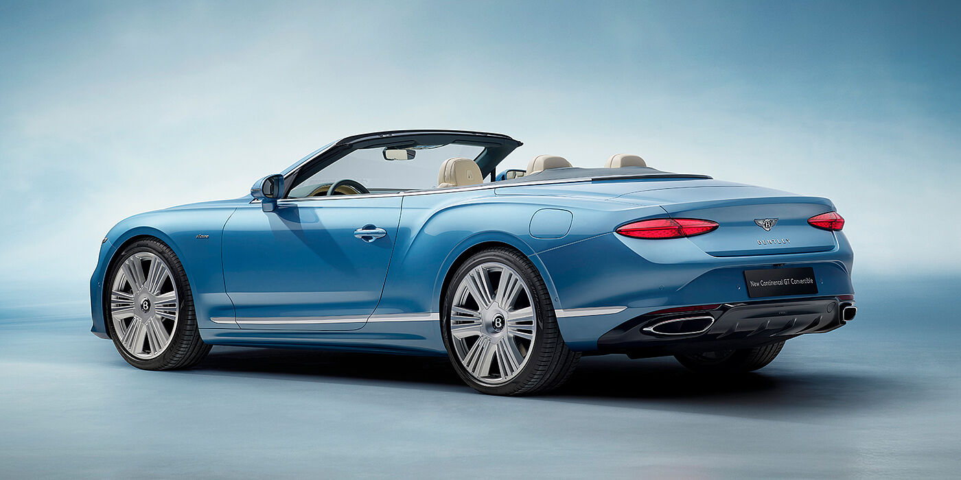 Bentley Paris Seine New Bentley Continental GTC Azure convertible rear view in Light Windsor blue paint with 22 inch ten spoke wheels and chrome exterior details