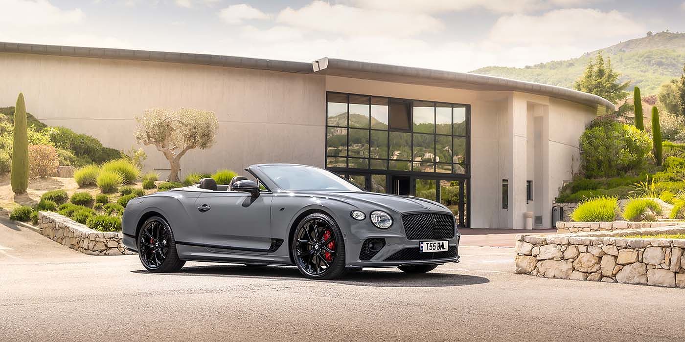 Bentley Paris Seine Bentley Continental GTC S convertible in Cambrian Grey paint front 34 static near house
