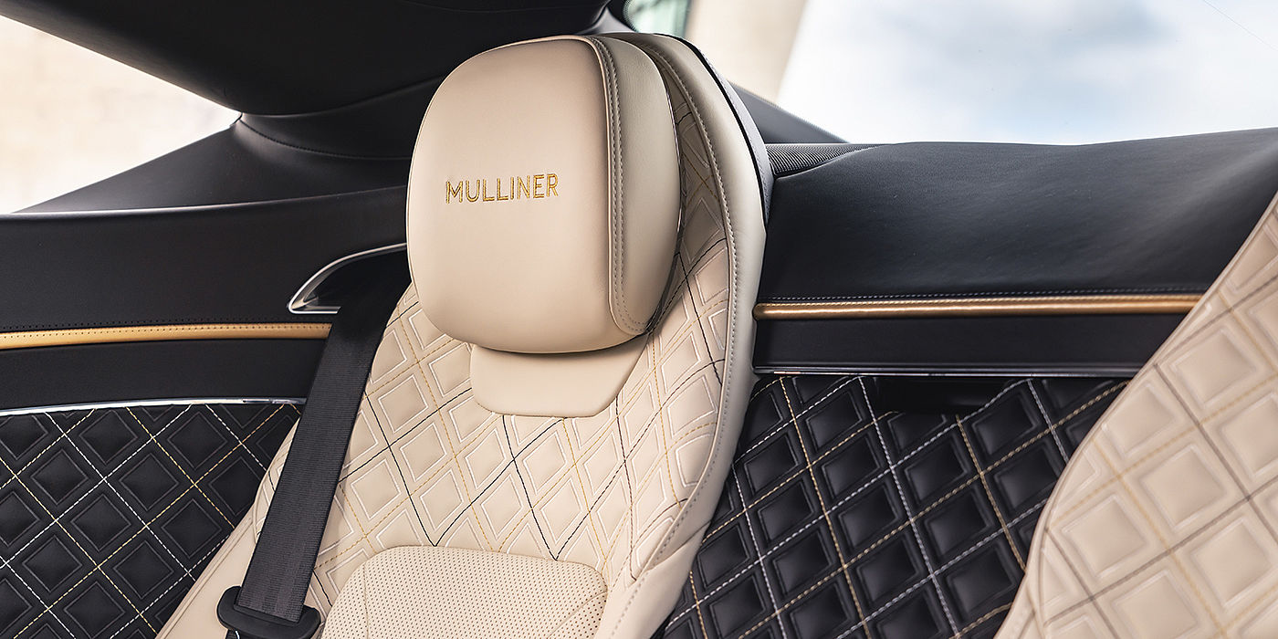 Bentley-Continental-GT-V8-Mulliner-rear-interior-with-Mulliner-seat-quilting-in-Beluga-black-and-Linen-leather-with-gold-accents