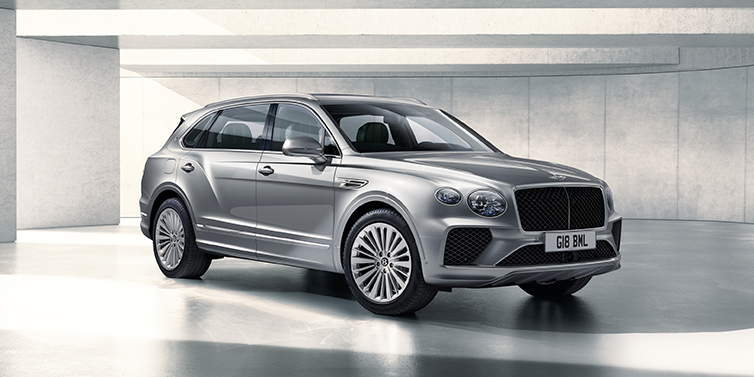 Bentley Paris Seine Bentley Bentayga Extended Wheelbase SUV front three quarter in Moonbeam paint with a grey background