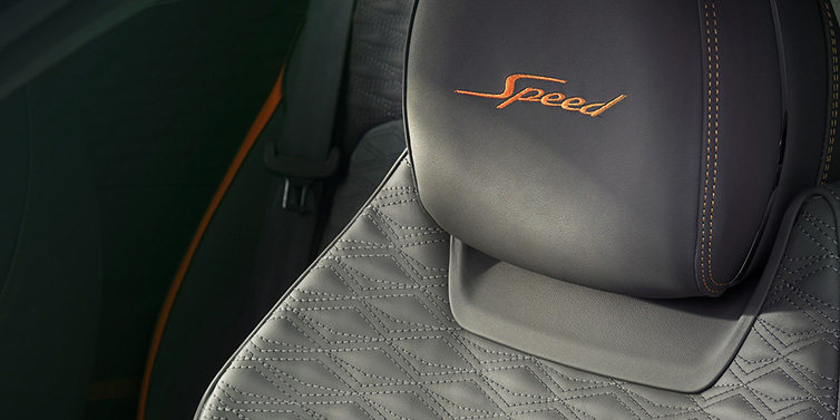 Bentley Paris Seine Bentley Continental GT Speed coupe seat detail in Gravity Grey hide and Speed emblem in Mandarin by Mulliner coloured embroidery