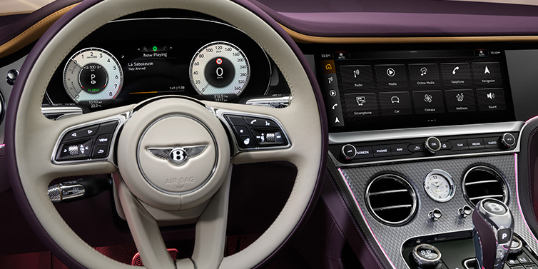 Bentley Paris Seine Bentley Continental GTC Mulliner convertible steering wheel and drivers screens surrounded by Damson purple and Linen hides